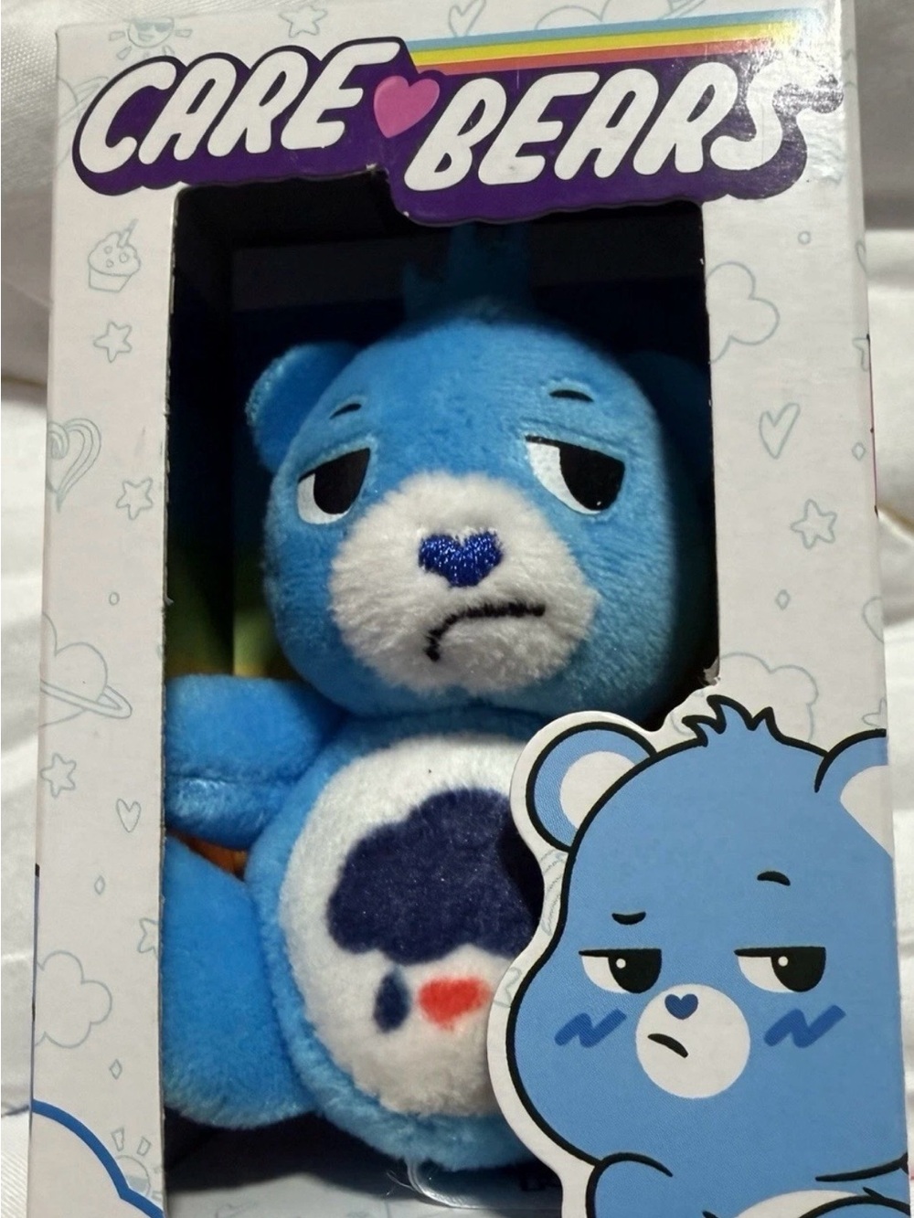 Mini Care Bears Blue Plush Bear with White Face and Navy Heart Belly Badge
4in